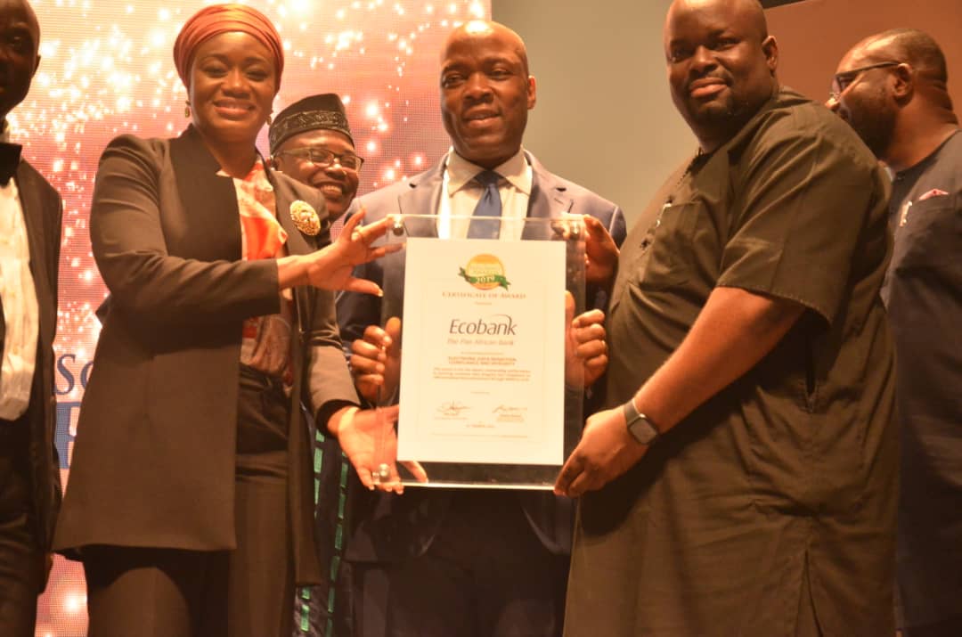 Left: Deputy Governor,  Financial Systems Stability, CBN,  Mrs Aishah Ahmad, Managing Director,  Ecobank Nigeria,  Patrick Akinwuntan and Head,  Consumer Distribution, Ecobank Nigeria,  Stanley Jacobs displaying the Electronic Data Rendition and Integrity  award won by Ecobank at the 4th Electronic Payments Incentive Scheme Efficiency awards organised by CBN/NIBSS in Lagos on Friday.