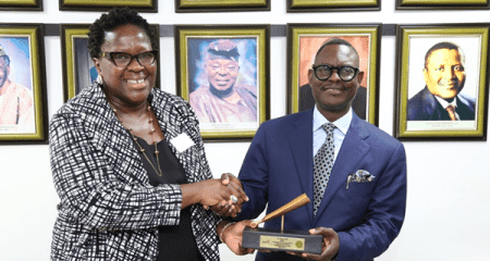 R-l: Chairman, Skyway Aviation Handling Company PLC, Dr (Barr) Taiwo Afolabi receiving the gong from the Executive Director, Regulation, NSE, Ms Tinuade Awe.