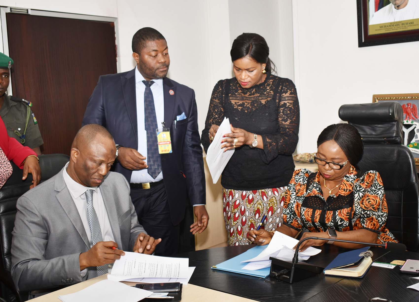L-R,  Director, Nigerian Financial Intelligence Unit, Mr Modibbo Tukur,  Head Public Affairs NFIU Mr Dominic Offor,  Head Legal, Securities and Exchange Commission Mrs Anastasia Braimoh and Acting, Director General,  SEC Ms Mary Uduk  during the Signing of MOU between SEC and NFIU in Abuja, Wednesday