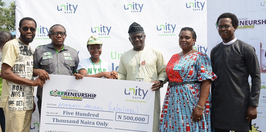 Principal Consultants, Peeshift, Abiodun Folawiyo, Div Head, Retail Banking, E-business & SME, Unity Bank Plc, Olufunwa Akinmade, Winner of the grand Prize of Unity Bank Corpreneurship Challenge, Miss Adebayo Abigail (LA/19C/1832), Lagos state NYSC Camp Director, Sunday Aroni, Assistant Director, Skills Acquisition & Entrepreneurship Development, Mrs Stella Nweke and CEO of WAPA Apparels, Adetola Adebola during the presentation of prizes to Winners of Unity Bank Corpreneurship Challenge organized in collaboration with the NYSC Skills Development and Entrepreneurship Development, (SAED) at the NYSC Orientation Camp in Lagos