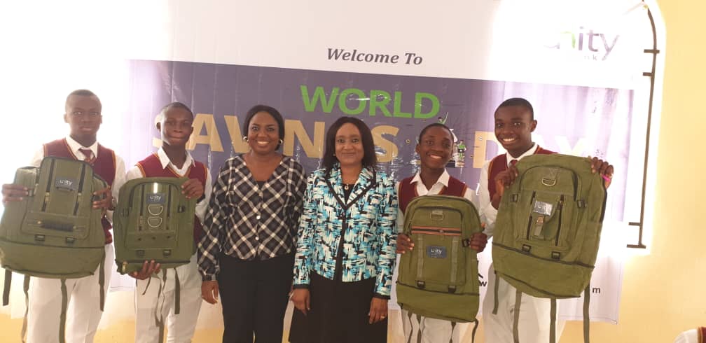 Caption: Chief Customer Service Officer, Unity Bank Plc, Mrs. Titilayo Abraham and Branch Manager, Stella Iheazue, Nkpor Branch, Unity Bank Plc flanked by Students of Dennis Memorial Grammar School, Onitsha, Anambra State during the World Savings Day Training.