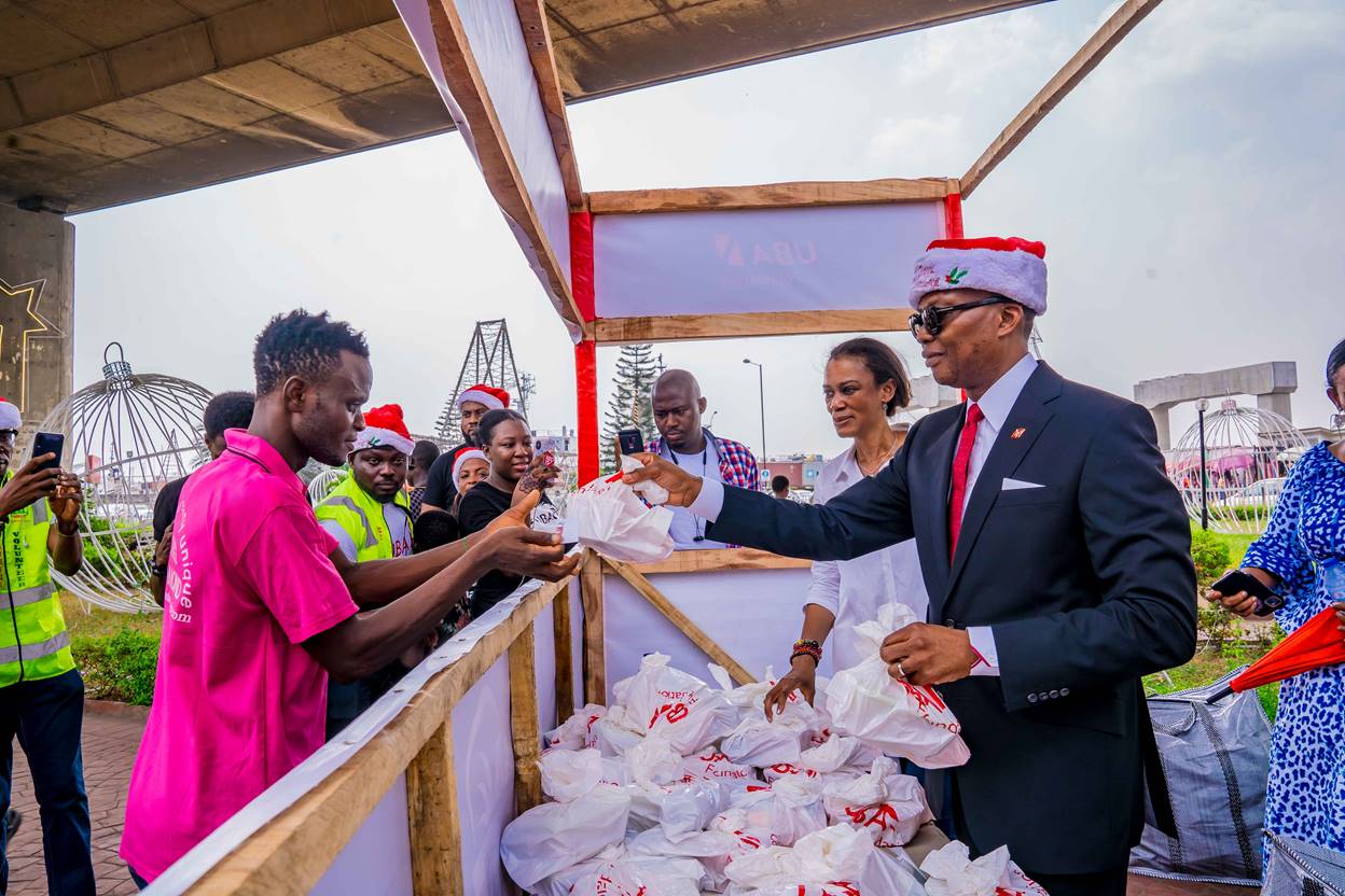 UBA's Group Managing Director/Chief Executive Officer, Mr. Kennedy Uzoka and CEO, UBA Foundation, Mrs. Bola Atta handing over food items and other goodies to the helpless and under-privileged at the Food Bank organised by UBA Foundation at the Foundation’s Garden and Roundabout in Marina, Lagos on Friday