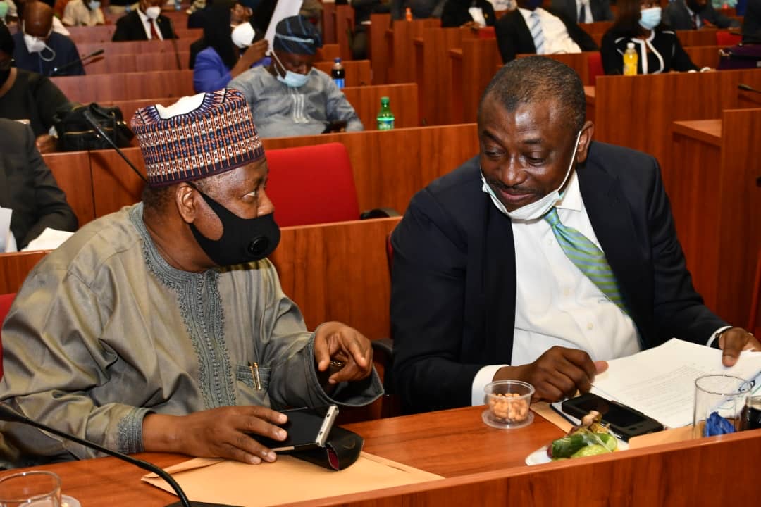 Nigeria Deposit Insurance Corporation (NDIC) MD/CE Umaru Ibrahim in a chat with the CEO of Nigerian Security Printing and Minting, Abbas Masanawa during the Public Hearing on the amendment of Banks and Other Financial Institutions Act 2004(Repeal and Re-enactment Bill, (BOFIA) 2020 at the National Assembly, Abuja.