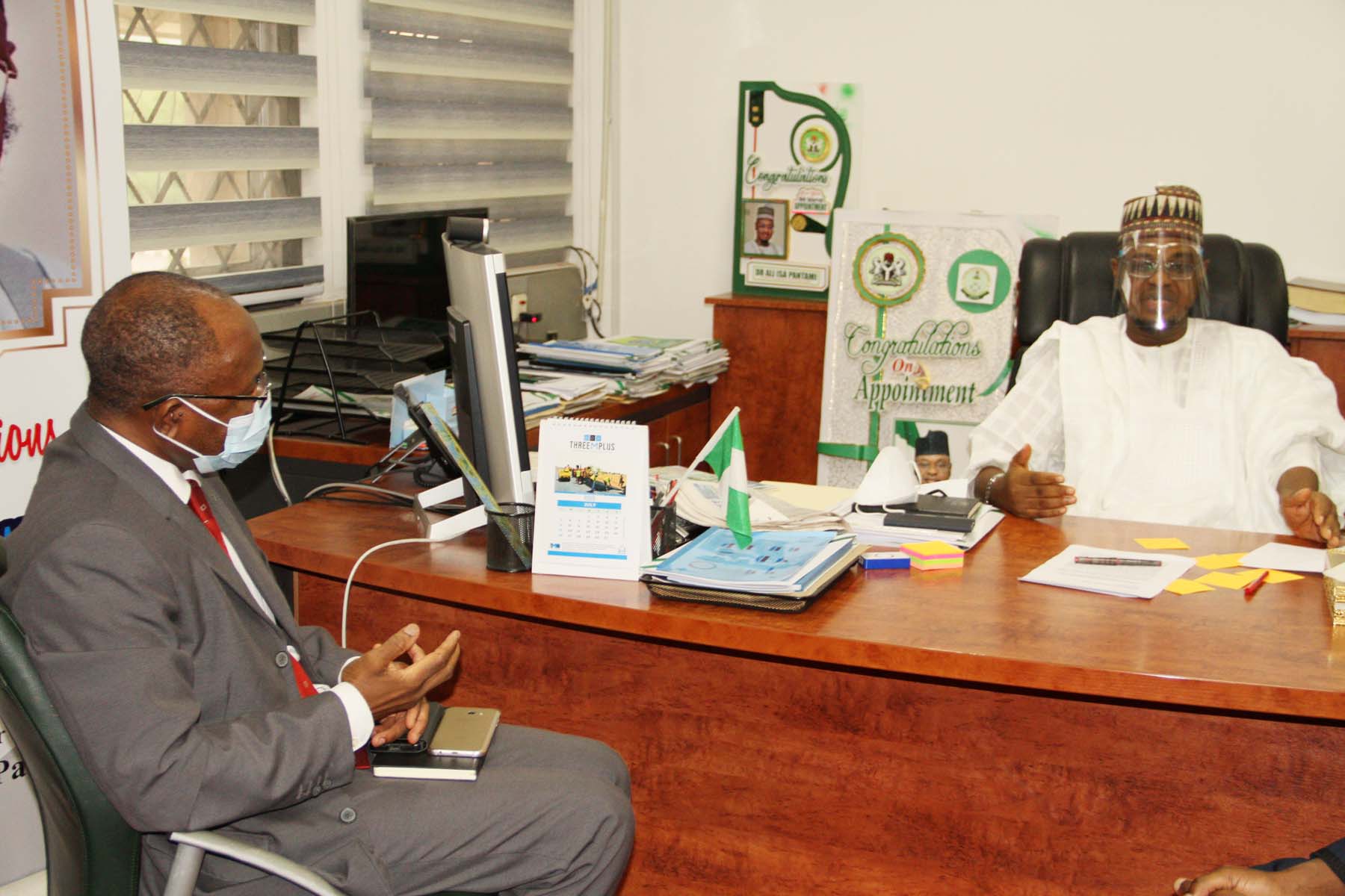 L-R,  Director General, Securities and Exchange Commission Mr Lamido Yuguda with Minister of Communications and Digital Economy Mr Ali Pantami during a Meeting between SEC and Minister of > Communications and Digital Economy in Abuja yesterday