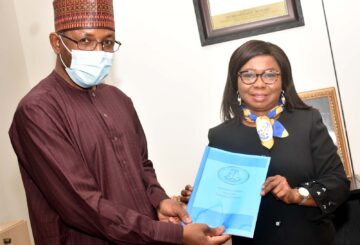 L-R, Incoming Director General, Securities and Exchange Commission Mr Lamido Yuguda with Outgoing Acting Director General SEC Ms Mary Uduk during the Resumption of the New Management of SEC in Abuja Monday