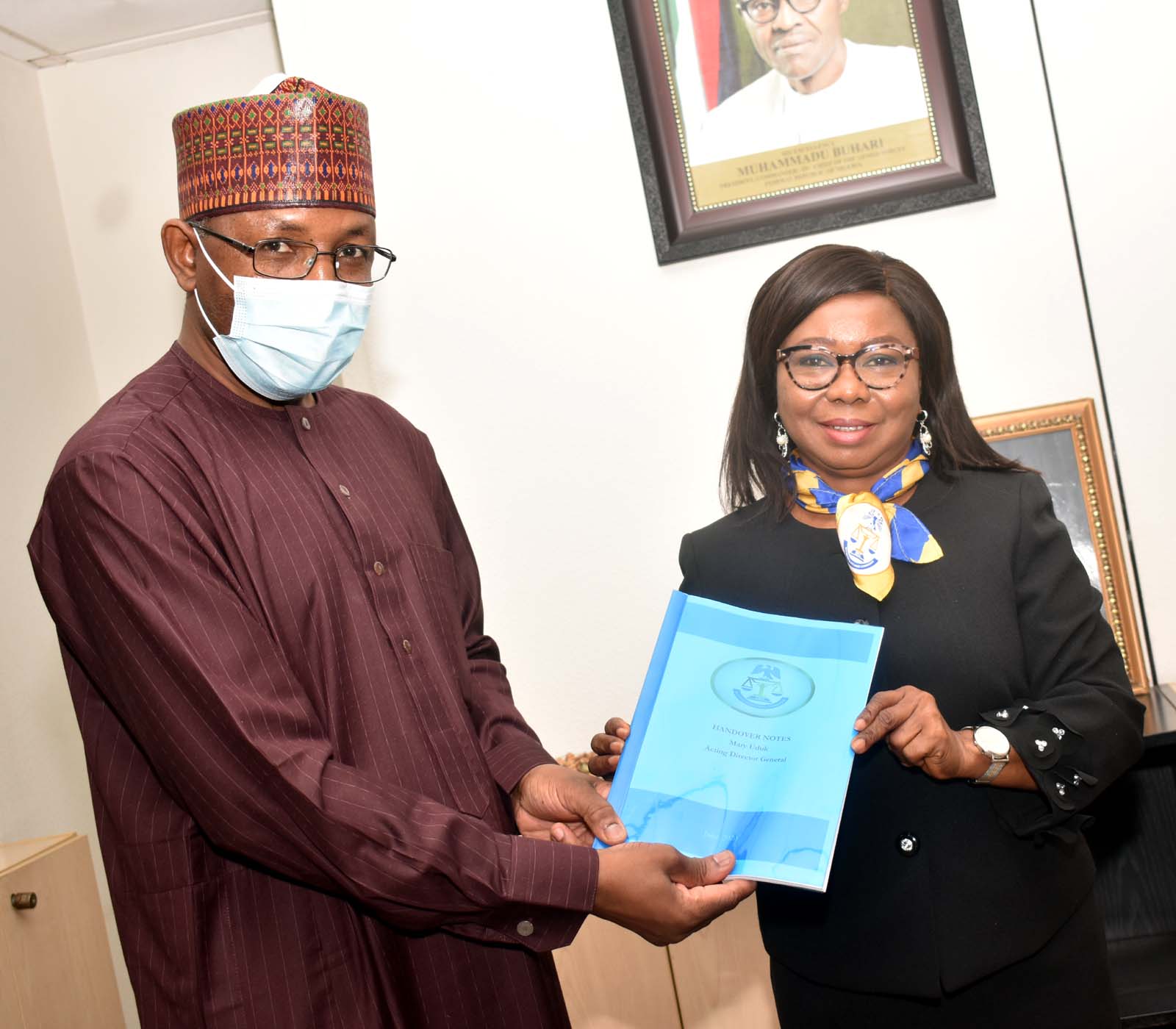 L-R,  Incoming Director General, Securities and Exchange Commission Mr Lamido Yuguda  with Outgoing Acting Director General SEC  Ms Mary Uduk during the Resumption of the New Management of SEC in Abuja Monday
