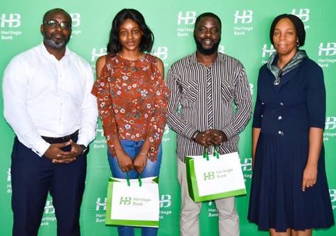 L-R- Victor Amakwe, Group Head, Private Wealth Management; Christiana Chukwu; Idowu Ilesanmi, both winners in the social media challenge of recitation of National Pledge in Pidgin English; and Cynthia Ndukuba, Head, Head Office Compliance Assurance, Compliance and Transaction Assurance during N1million cheque presentations to four winners of the videos recitation of “National Pledge” in Pidgin English, in celebration of Nigeria @ 60th at the bank’s head office.   