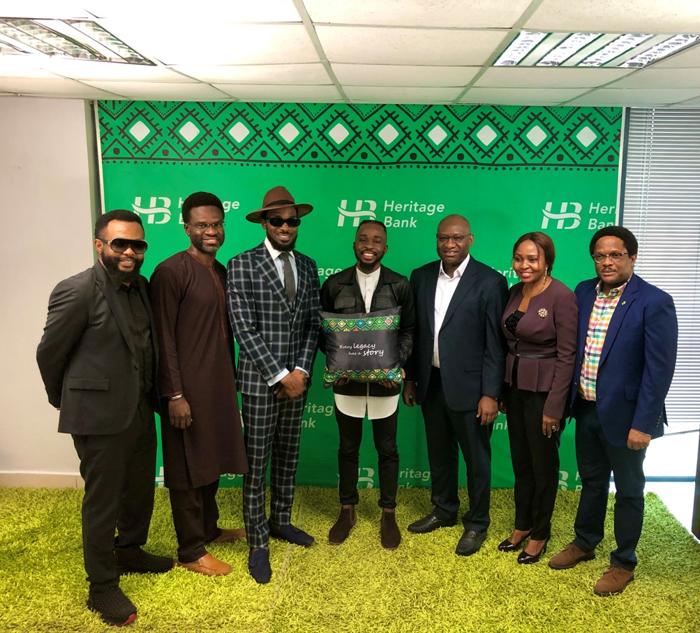 L-R: MD/CEO, Heritage Bank Plc, Ifie Sekibo (5th from Left); CEO, Cream Platform, Damian Okoroafor; Musician and Ynspyre Account’s Ambassaor, Daniel Oyebanjo (D'banj); Winner of Ynspyre Account N1m online giveaway competition, Damilola Adeyemi; Group Head, Entertainment, Lagos Island 1 Zone, Kufretido Etim and Dike Dimiri, Regional Executive, Lagos & South-West, during the N1million cheque presentation to the winner of an online giveaway competition to celebrate the bank’s Ynspyre Account ambassador, inspired by Heritage Bank yesterday at the bank’s head office.
