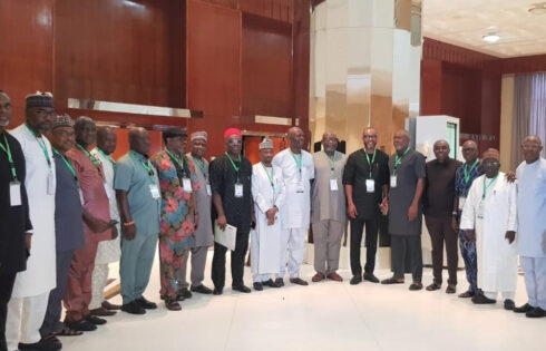 Chairman House of Representatives Committee on Banking and Currency, Hon. Victor Nwokolo (standing 12th from left), and the Group Head, Asset Management Directorate of AMCON Mr Matthew Coker (standing 9th from right) with other members of the National Assembly and senior staff of AMCON at the just concluded retreat in Lagos.